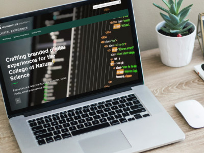 laptop with college of natural science website pulled up