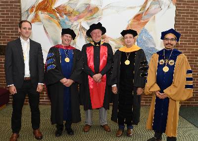 NatSci Dean Phil Duxbury (center) poses with NatSci honorees at the 2022 all-university investiture (L to R): François Greer, Timothy Warren, Jonas Becker and Danny Caballero. Not pictured: Thomas O’Halloran and Aman Yadav. 