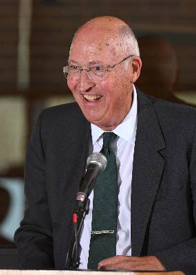 Dan Van Haften giving remarks at a podium during the Van Haften professorship ceremony at MSU's Wharton Center.