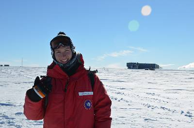 MSU postdoctoral research associate Hans Niederhausen standing outside of the Ice Cube facility in Antarctica. 