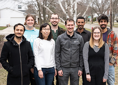 A photo of the Walker lab team at Michigan State University. In the front row, left to right: postdoctoral scholars Binod Basyal and Xinyu Fu, Assistant Professor Berkley Walker and graduate student Kaila Smith. In the back row, left to right: laboratory technician Heather Roney, graduate student Luke Gregory and postdoctoral scholars Kelem Gashu Alamrie and Mauricio Tejera-Nieves.