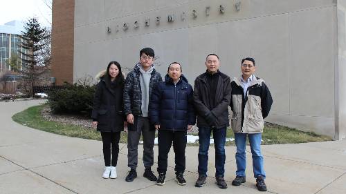 Part of the research team at MSU that has worked on the ZIP protein stands in front of the biochemistry building.From left to right: graduate students Peixuan Yu and Yuhan Jiang, postdoctoral research accociate Yao Zhang, Associate Professor Jian Hu and MSU Foundation Professor Guowei Wei. 