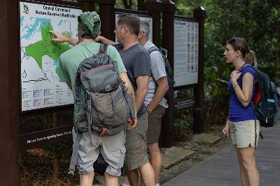 XPRIZE team members check out the map of Singapore's Windsor Nature Park,the site of the XPRIZE Rainforest semifinals, as they get familiar with the terrain.