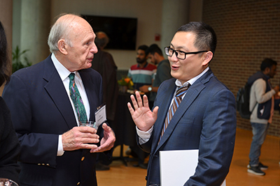 MSU's Tuo Wang, inaugural Carl H. Brubaker, Jr., Endowed Professor, talks with Jim Hoeschele, the donor of the position, at the reception following his investiture ceremony