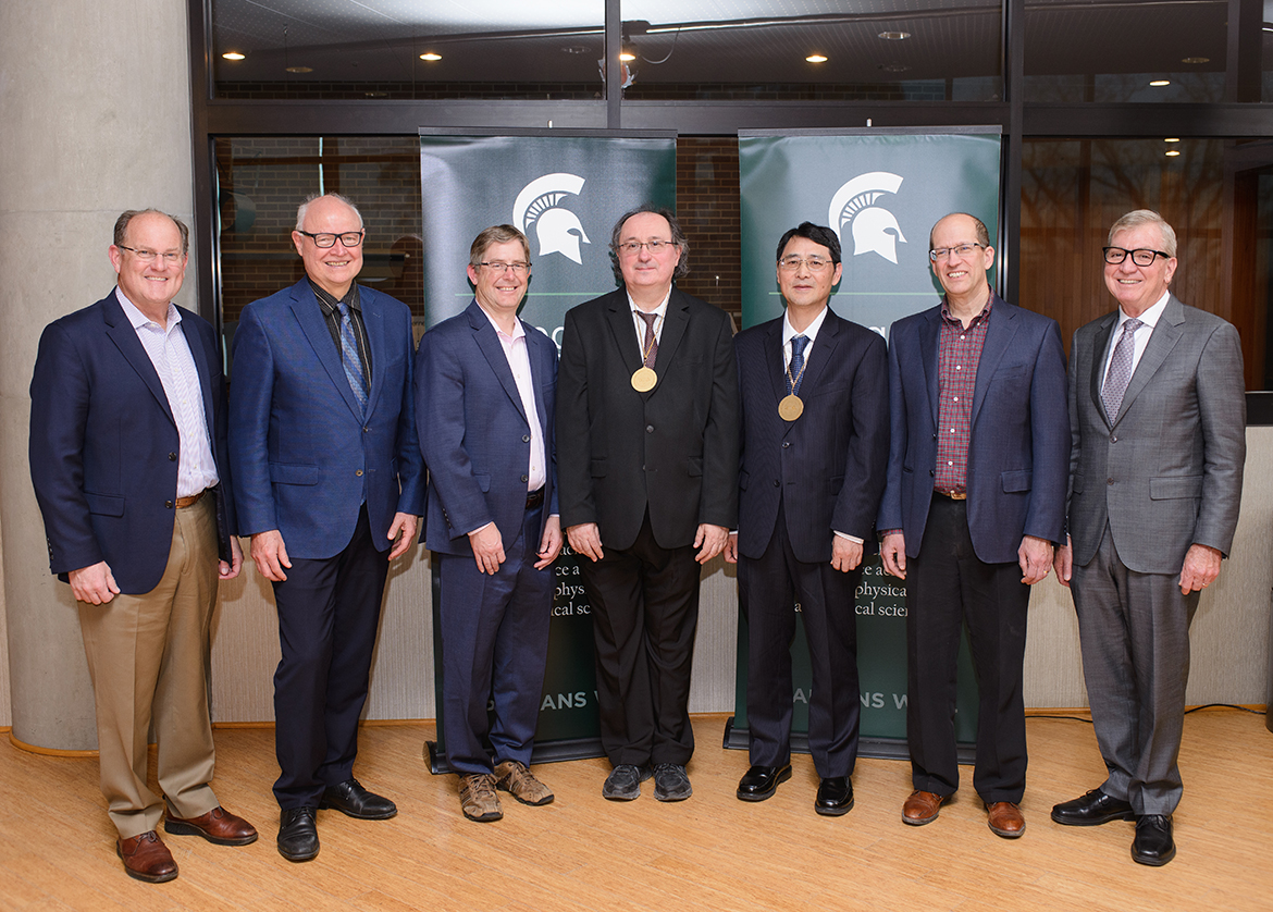 From left to right: David Washburn, Executive Director of the MSU Research Foundation; Phil Duxbury, Dean of the College of Natural Science; Timothy Warren, chair of the Department of Chemistry; Piotr Piecuch and Guowei Wei, the newly medaled MSU Research Foundation Professors; Keith Promislow, chair of the Department of Mathematics; and Doug Gage, vice president of Research and Innovation at MSU.