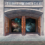 Front of MSU College of Natural Science building, doors open and the cosmos is displayed inside.