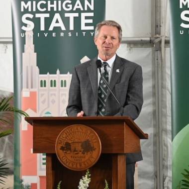 President Kevin Guskiewicz speaks at a podium