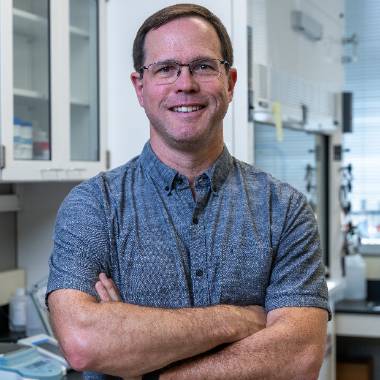 MSU Researcher Eran Andrechek smiles for a picture