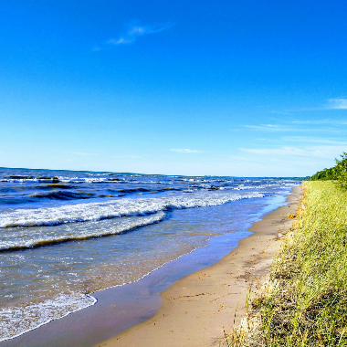 Shoreline of a lake under the horizon.