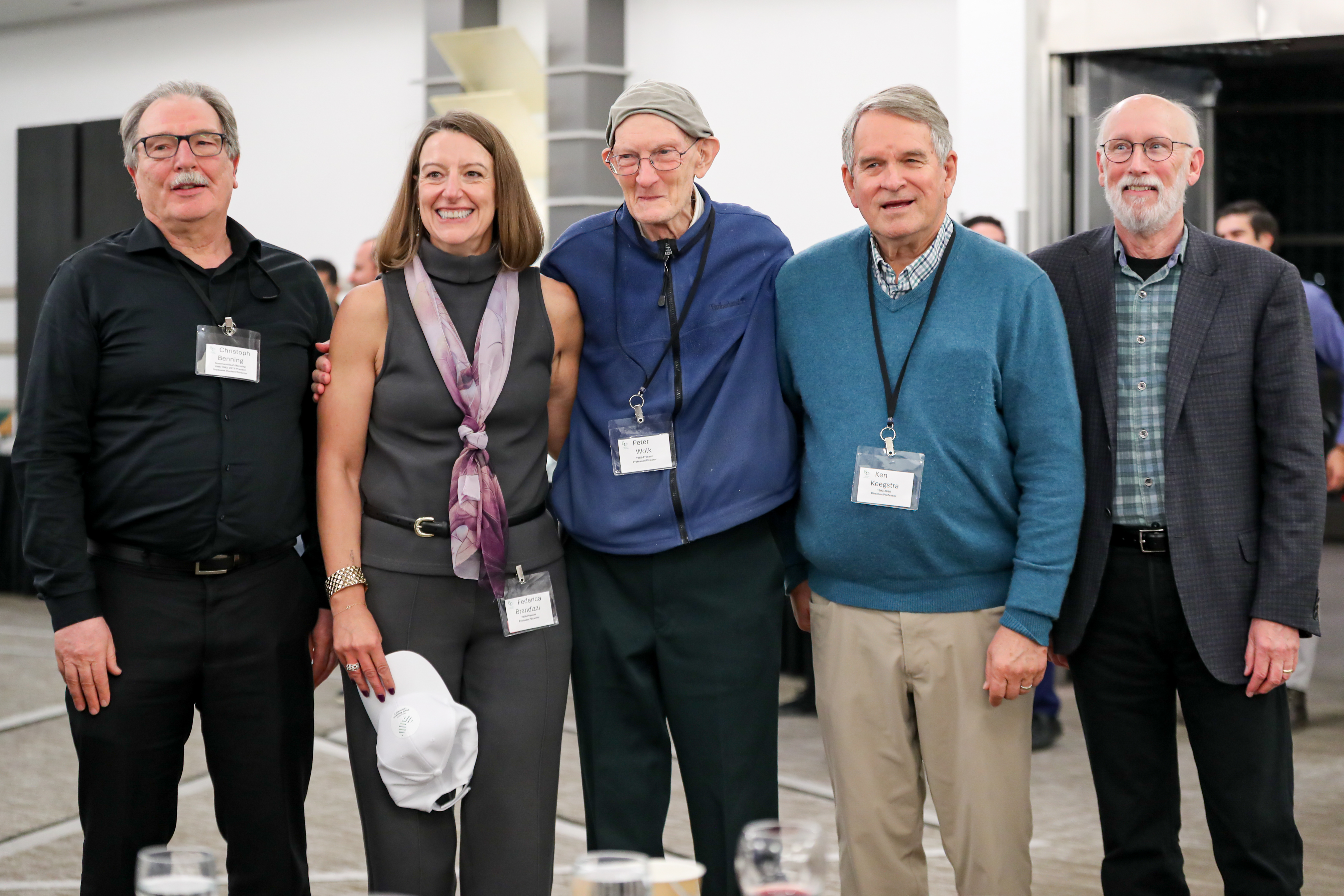 Five people stand for the camera