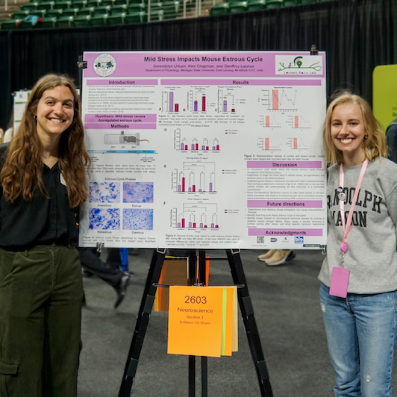 Urbain and Chapman pose Urbain's research poster at UURAF.