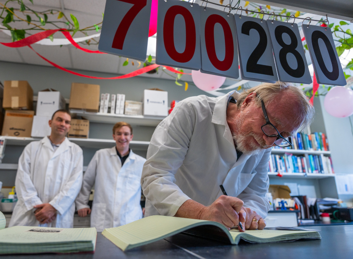 Richard Lenski updates the lab book in the Long Term Evolution Experiment Lab