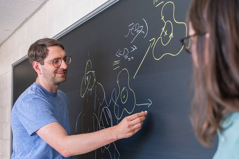 Matt Stoffregen working at a chalkboard
