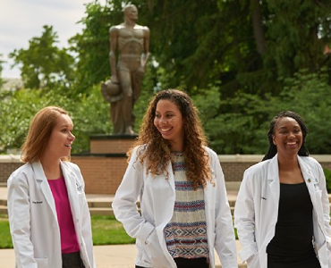 group of people wearing lab coats