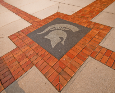 Spartan helmet on a sidewalk