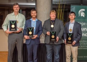 Image of Freymueller, Hardisty, McNamara and Wei with medals