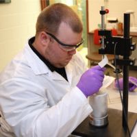 Image of Jason Shrad freezing samples in the lab