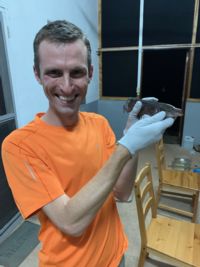 Image of Jason Gallant holding an electric fish
