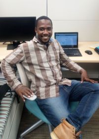 Image of Sam Ayebare in his office.