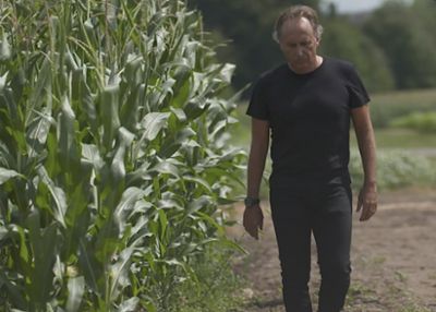Shot of Bruno Basso walking in a corn field