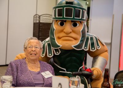 Dr. Esther Brown and Sparty at the BLD 90th anniversary gala. 