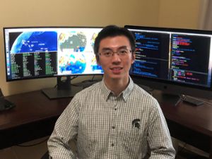 Image of Shawn Wei with computer simulations in the background.