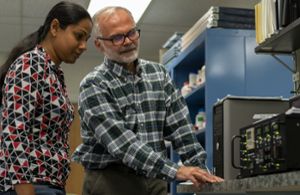 Image of Dr. Sharkey in the lab with research assistant professor Sarathi Weraduwage